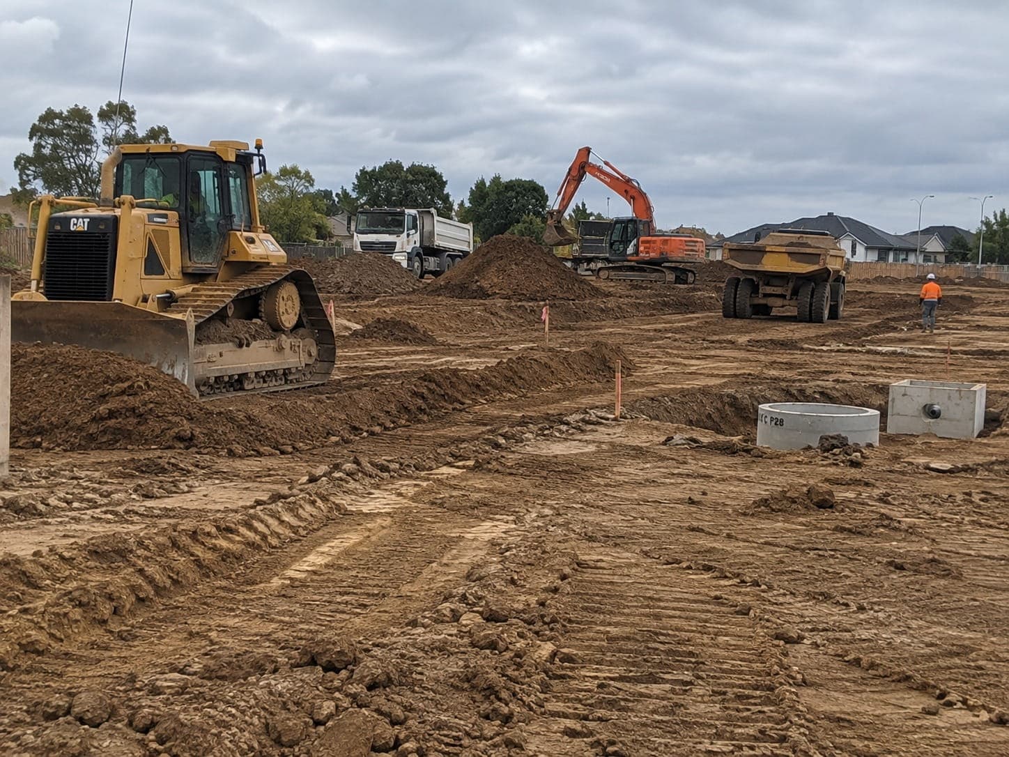 Dozer and excavator working across a subdivision site
