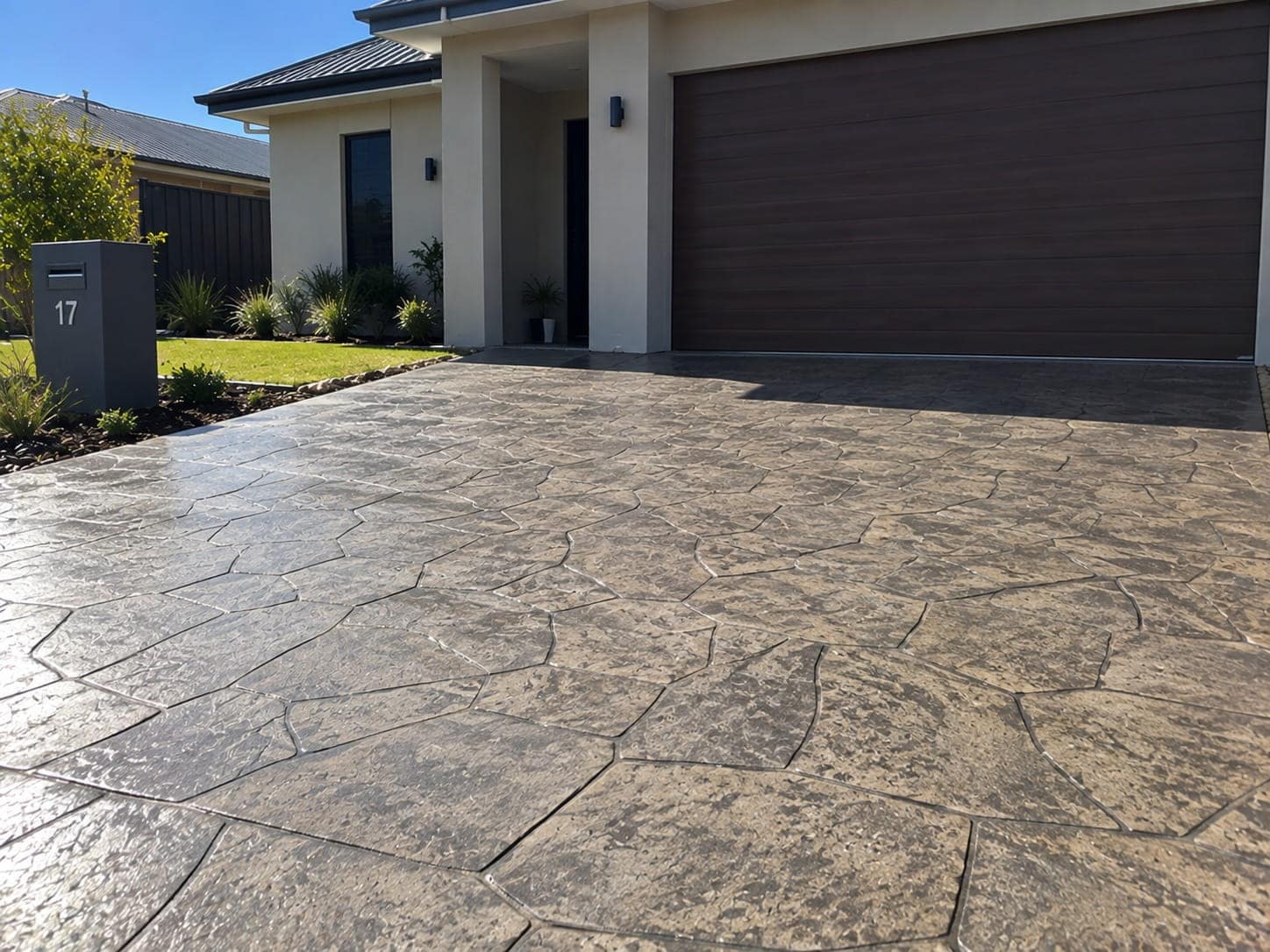 Flagstone-pattern stamped concrete driveway