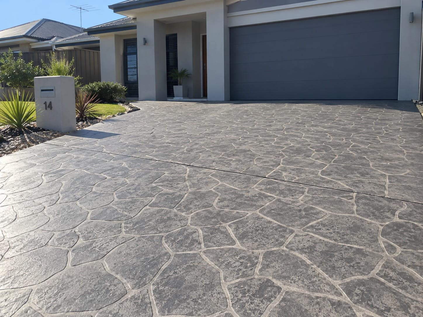 Flagstone-pattern stencilled concrete driveway